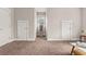 This carpeted bonus room features ample space and natural light at 135 Marshside Dr, Summerville, SC 29485