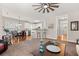 Open-concept living room flows into a kitchen with white cabinets and a breakfast bar at 135 Marshside Dr, Summerville, SC 29485