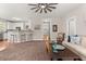 Spacious living room with a view of the kitchen, featuring ample seating and a modern design at 135 Marshside Dr, Summerville, SC 29485