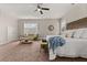 Spacious primary bedroom with sitting area and king bed at 135 Marshside Dr, Summerville, SC 29485