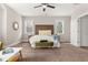 King bed is the focal point of this spacious primary bedroom at 135 Marshside Dr, Summerville, SC 29485