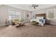 Spacious primary bedroom with sitting area and king bed at 135 Marshside Dr, Summerville, SC 29485