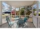 White railed patio with metal table and chairs and views of a backyard with trees at 135 Marshside Dr, Summerville, SC 29485