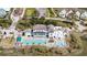 Luxury estate featuring a pool, lounge area, and water views, nestled within a lush, green community at 1466 Mizzen Aly, Johns Island, SC 29455