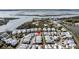 Aerial view of a charming community featuring waterfront views, lush greenery, and meticulously landscaped streets at 1466 Mizzen Aly, Johns Island, SC 29455