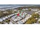 Aerial view of a picturesque community with waterfront access, a tranquil lake, and lush greenery at 1466 Mizzen Aly, Johns Island, SC 29455