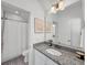 Bright bathroom showcasing granite countertop, framed art, and shower-tub combo at 1466 Mizzen Aly, Johns Island, SC 29455