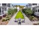 Inviting common area featuring Adirondack chairs and landscaping, perfect for relaxing and socializing at 1466 Mizzen Aly, Johns Island, SC 29455