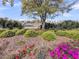 Beautiful landscaping and a park bench surround a lake in this community with charming homes at 1466 Mizzen Aly, Johns Island, SC 29455