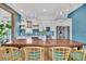Stylish kitchen with white cabinets, blue backsplash, and open layout to the dining area at 1466 Mizzen Aly, Johns Island, SC 29455