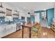 Modern kitchen with white cabinets, stainless steel appliances, and a large wooden island with seating at 1466 Mizzen Aly, Johns Island, SC 29455