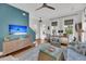 Inviting living room with a stylish rug, comfortable seating, and beach themed television display at 1466 Mizzen Aly, Johns Island, SC 29455