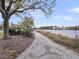 A gravel walking path with lovely trees and a waterfront view in a beautiful neighborhood at 1466 Mizzen Aly, Johns Island, SC 29455