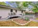 Backyard featuring an elevated deck, a chicken coop, and a cozy seating area near the house at 1531 Seacroft Rd, James Island, SC 29412
