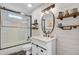 Updated bathroom with tub-shower combo, tile walls, and modern vanity at 1531 Seacroft Rd, James Island, SC 29412