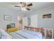 Cozy bedroom with ceiling fan, window and carpet at 1531 Seacroft Rd, James Island, SC 29412