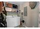 Functional laundry room with washer, dryer and storage shelving at 1531 Seacroft Rd, James Island, SC 29412