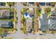Aerial view showcasing the neighborhood, mature trees, private pool, and well-maintained landscaping at 1555 Willtown St, Daniel Island, SC 29492