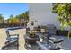 Private backyard includes a firepit with Adirondack chairs, a built-in grill, and a swimming pool at 1555 Willtown St, Daniel Island, SC 29492
