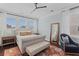 Comfortable bedroom with plush bedding, accent chair, and large windows for natural light at 1555 Willtown St, Daniel Island, SC 29492