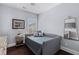 Inviting bedroom with daybed, soft blue walls, and a window with natural light at 1555 Willtown St, Daniel Island, SC 29492