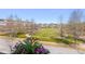 Scenic view of community green space with walking paths, trees, and charming neighborhood homes at 1555 Willtown St, Daniel Island, SC 29492