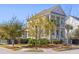 Charming two-story home with dual covered front porches and professionally landscaped yard at 1555 Willtown St, Daniel Island, SC 29492