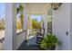 Cozy front porch offers serene views with rocking chairs, a stylish rug, and well-placed greenery at 1555 Willtown St, Daniel Island, SC 29492