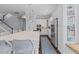 This bright, white kitchen features a large island with seating and stainless appliances at 1555 Willtown St, Daniel Island, SC 29492