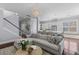 Spacious living room flowing into the kitchen, featuring hardwood floors, and stylish decor at 1555 Willtown St, Daniel Island, SC 29492