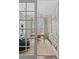Bright and airy home office featuring French doors, custom shelving, and a well-appointed workspace at 1555 Willtown St, Daniel Island, SC 29492