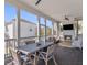 Screened porch features a fireplace, a large table, and ample seating for entertaining at 1555 Willtown St, Daniel Island, SC 29492