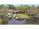 Aerial view of waterfront property with a private boat dock and boat launch at 1673 Mcclain St, Charleston, SC 29407