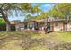 Charming brick home showcasing a large, inviting wood deck perfect for outdoor entertaining at 1673 Mcclain St, Charleston, SC 29407