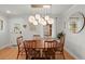 Inviting dining room with wood table, chairs, natural light, and decorative lighting at 1673 Mcclain St, Charleston, SC 29407