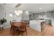 Open concept living with kitchen featuring an island, bar seating, quartz countertops, and stainless steel appliances at 1673 Mcclain St, Charleston, SC 29407