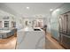 Modern kitchen featuring a large island with a sink and stainless steel appliances at 1673 Mcclain St, Charleston, SC 29407