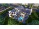 Breathtaking aerial shot of the property showcasing the pool, manicured lawns, and serene neighborhood surroundings at 1715 Middle St, Sullivans Island, SC 29482