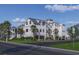 Stunning exterior view of the home highlighting the three-car garage, landscaping, and classic architectural style at 1715 Middle St, Sullivans Island, SC 29482