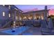Inviting pool area with lounge chairs, outdoor seating, and well-lit porch overlooking the sparkling blue water at 1715 Middle St, Sullivans Island, SC 29482