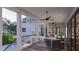 Spacious outdoor porch featuring comfortable seating and a beautiful view of the backyard and swimming pool at 1715 Middle St, Sullivans Island, SC 29482