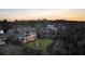 Picturesque aerial view of the home with a backyard fire pit and covered deck surrounded by trees at 1857 W Canning Dr, Mount Pleasant, SC 29466