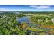 Gorgeous aerial view of waterfront homes connected by docks, surrounded by beautiful landscapes at 1857 W Canning Dr, Mount Pleasant, SC 29466