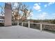Spacious back deck with cable railings and views of the landscape, trees and marsh at 1857 W Canning Dr, Mount Pleasant, SC 29466
