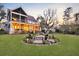 Beautiful backyard with a charming fire pit, seating, and a view of the screened in back porch at 1857 W Canning Dr, Mount Pleasant, SC 29466