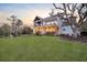 Spacious backyard featuring a fire pit, lush green lawn, and a charming two-story home at 1857 W Canning Dr, Mount Pleasant, SC 29466
