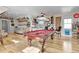 Finished basement featuring hardwood floors, a pool table, and a wet bar, perfect for entertainment and relaxation at 1857 W Canning Dr, Mount Pleasant, SC 29466