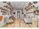 Basement with a cozy seating area, unique wall decor, and hardwood floors, perfect for relaxation at 1857 W Canning Dr, Mount Pleasant, SC 29466
