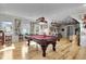 Basement with hardwood floors, a pool table, bar stools and unique decor, ideal for entertaining guests at 1857 W Canning Dr, Mount Pleasant, SC 29466