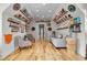 Basement with a cozy seating area, unique wall decor, and hardwood floors, perfect for relaxation at 1857 W Canning Dr, Mount Pleasant, SC 29466